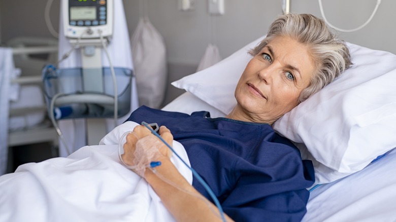 Woman laying in hospital bed