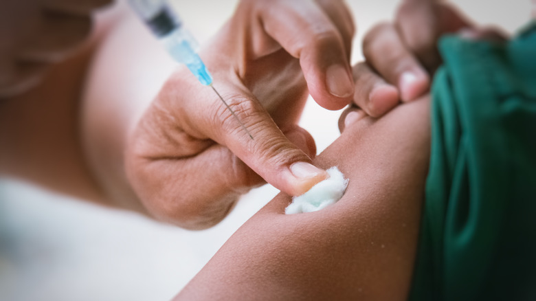 Patient receives vaccination in arm