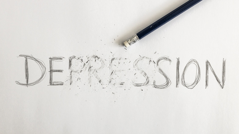 Depression written on white paper