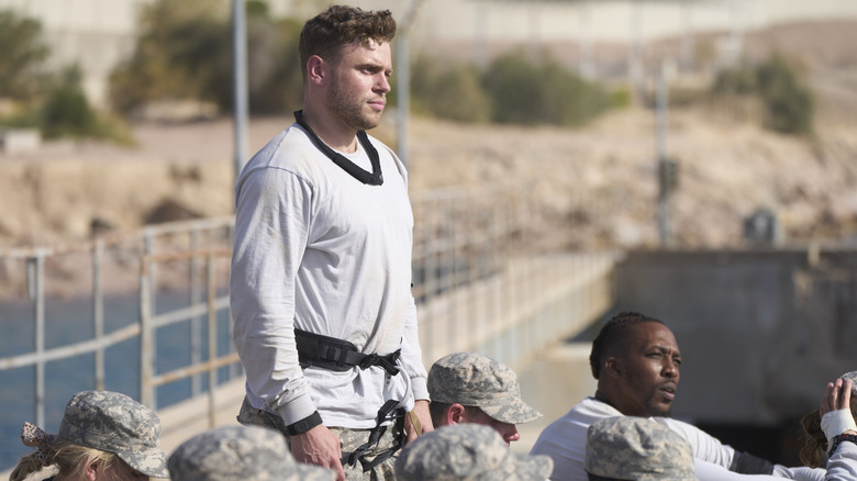 Gus Kenworthy standing during training exercise