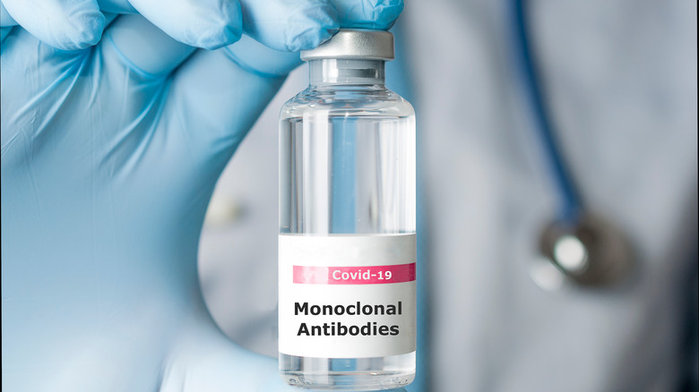 tech holding vial of monoclonal antibodies