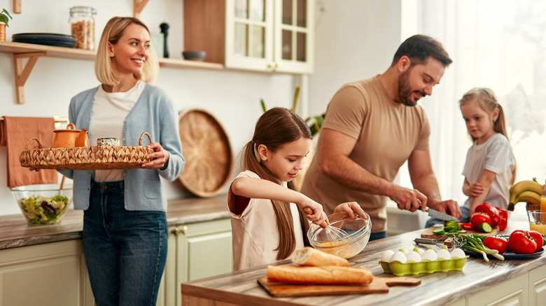 A family cooking dinner in their kitchen