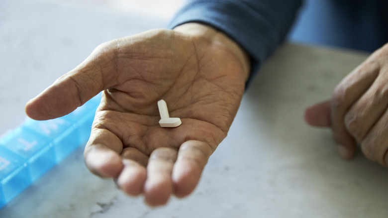 pills in a man's hand