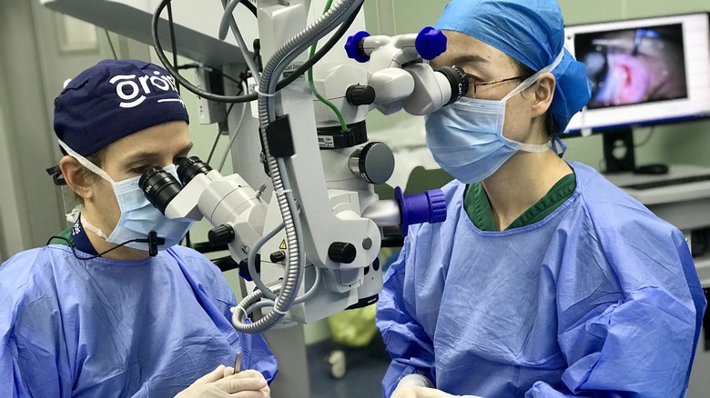 Dr. Annette Giangiacomo performing surgery with a colleague