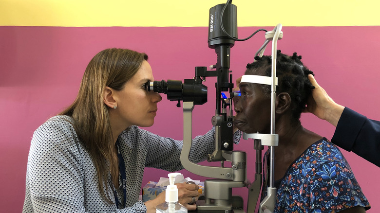 Dr. Annette Giangiacomo performing an eye exam