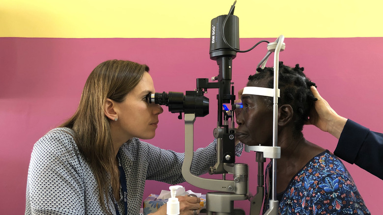 Dr. Annette Giangiacomo performing an eye exam