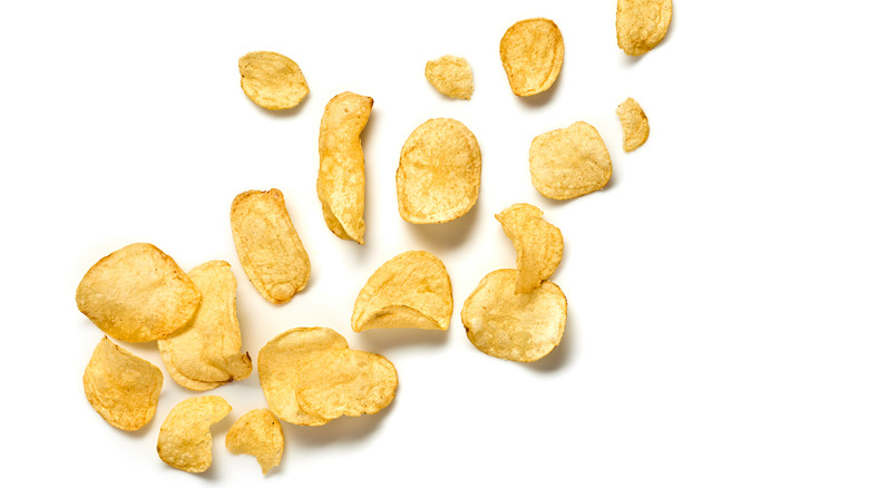 potato chips spread across a white background