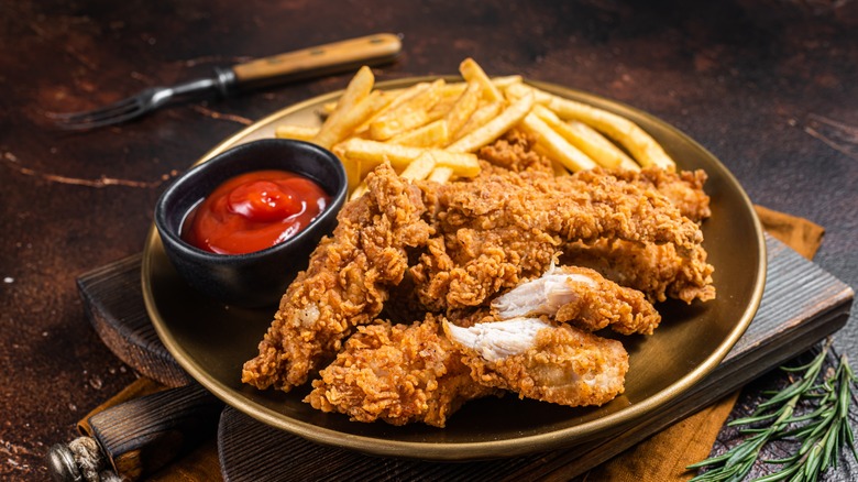 Plate of chicken tenders and french fries 