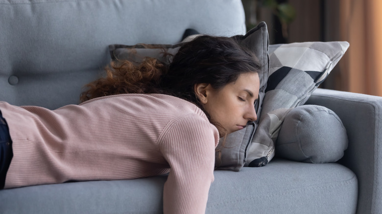 woman sleeping on a couch