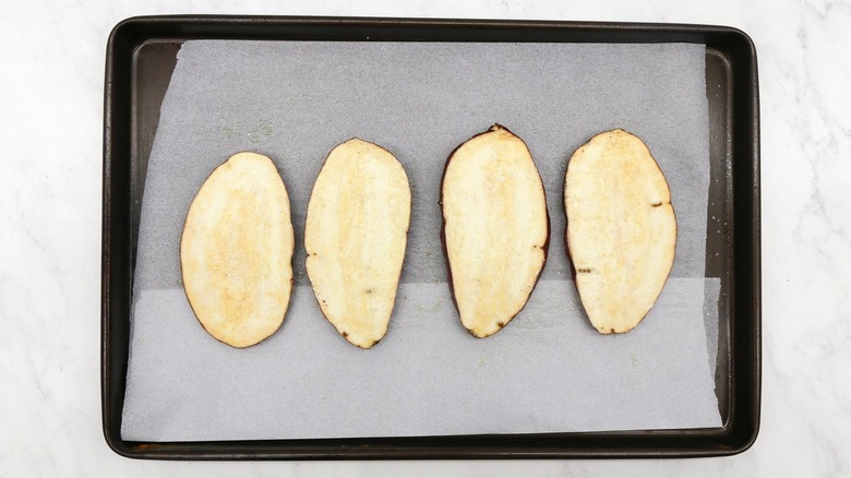 Sweet potato slices on baking sheet