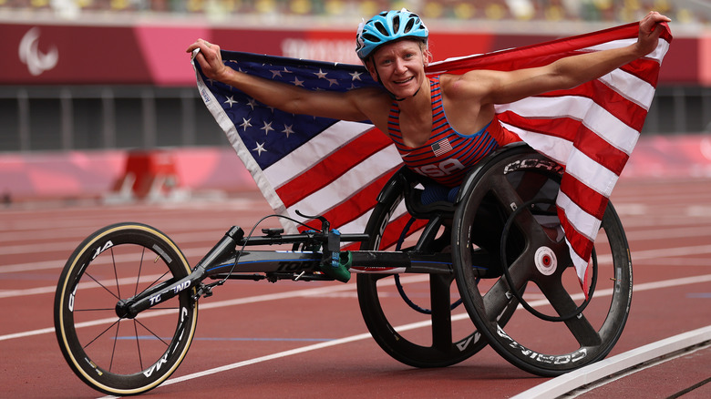 Susannah Scaroni holding American flag after race