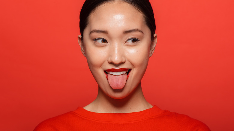 woman sticking out tongue