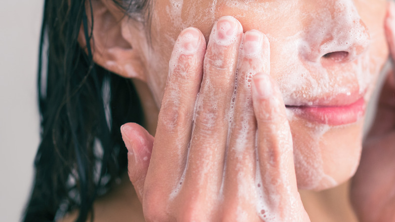 closeup of a woman washing her face