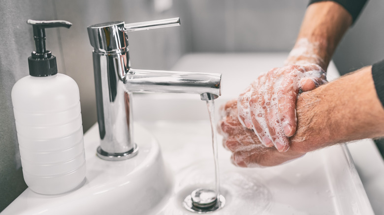 closeup of man washing hands 