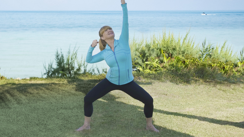 Miranda Esmonde-White stretching by the beach