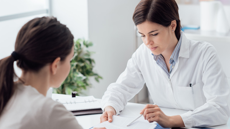 doctor consultation with young woman