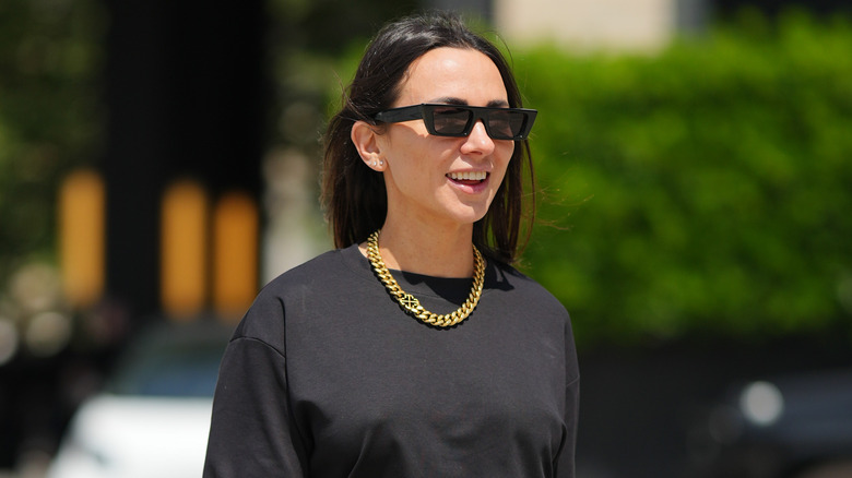 woman wearing black tshirt and sunglasses