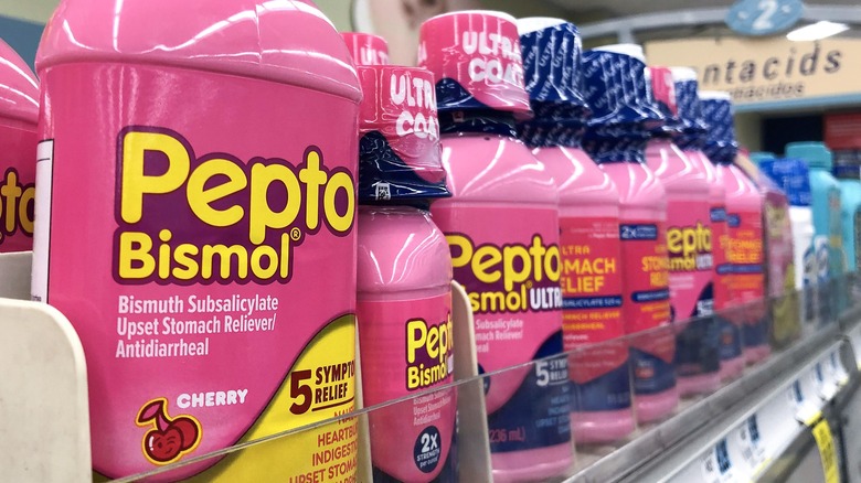 Bottles of Pepto Bismol on store shelf