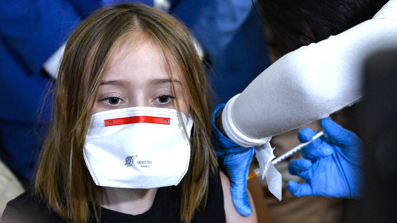 Girl receiving covid shot