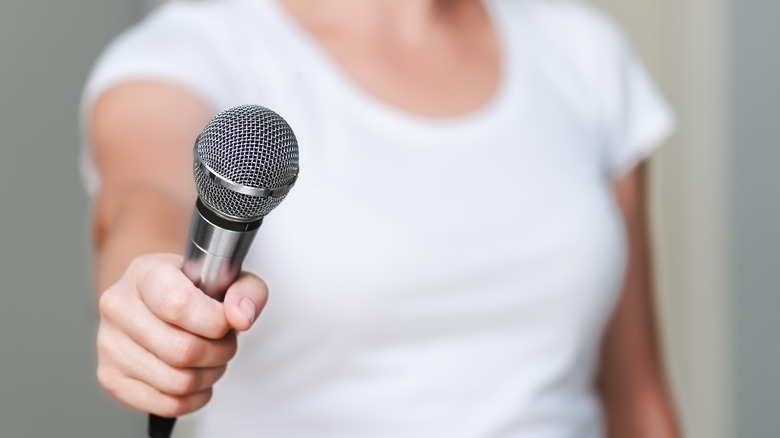person holding a microphone