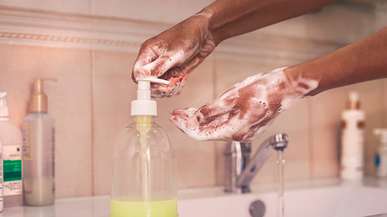 person washing their hands