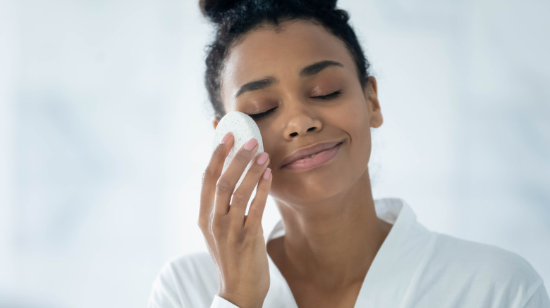 Woman removing makeup