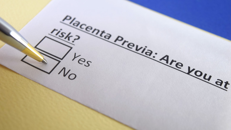 paper reading "placenta previa?" with check boxes 