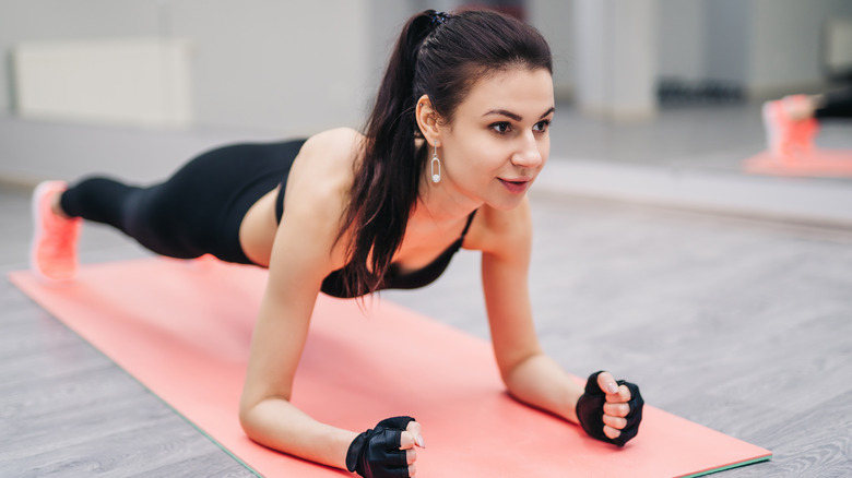 woman doing forearm plank