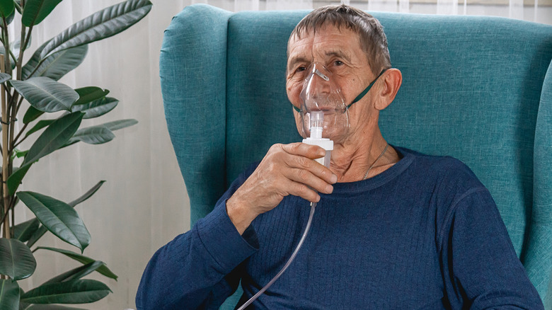 Elderly man with oxygen mask