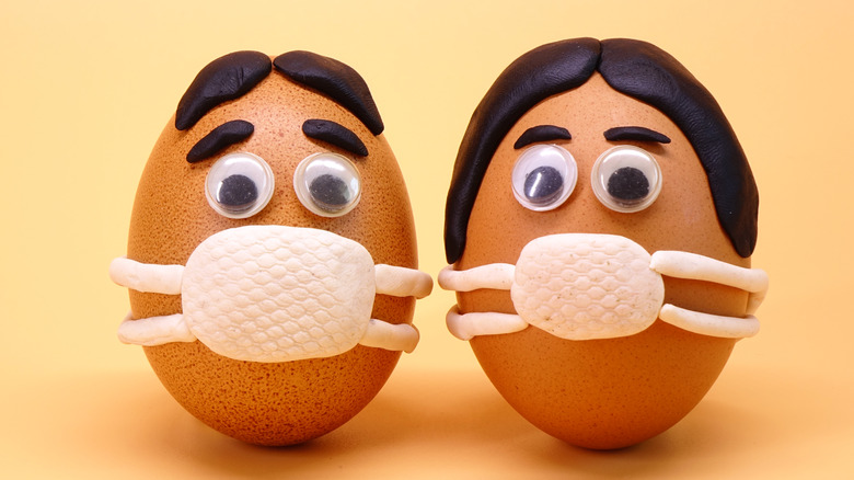 Eggs designed as people wearing masks