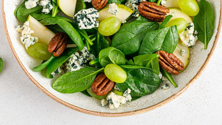 salad in bowl against white background