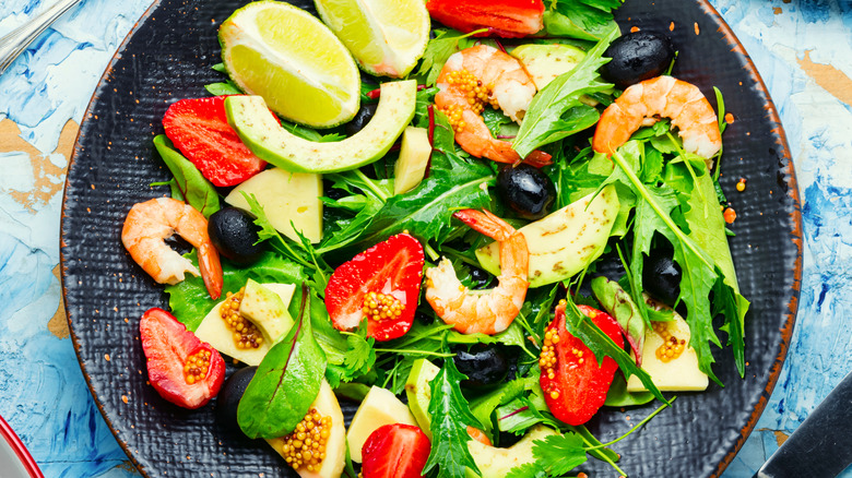 large salad bowl against blue table