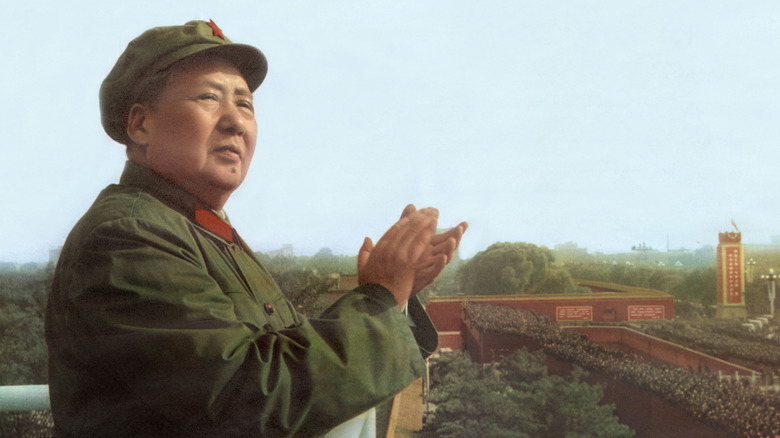 Mao Zedong standing on a building