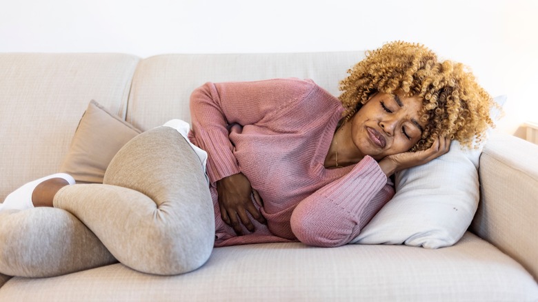 woman holding stomach