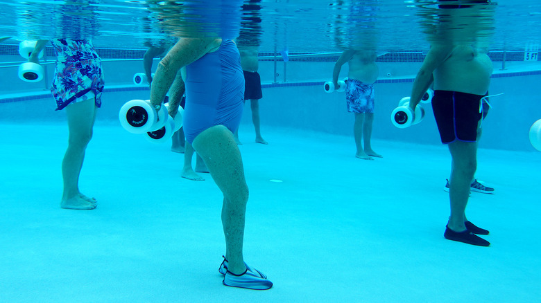 group of people doing water aerobics