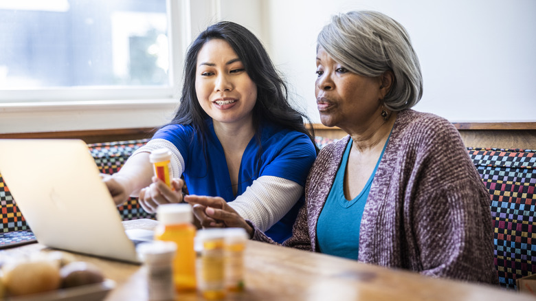 nurse educating patient about medications