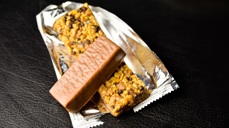 Two protein bars stacked together on top of a wrapper