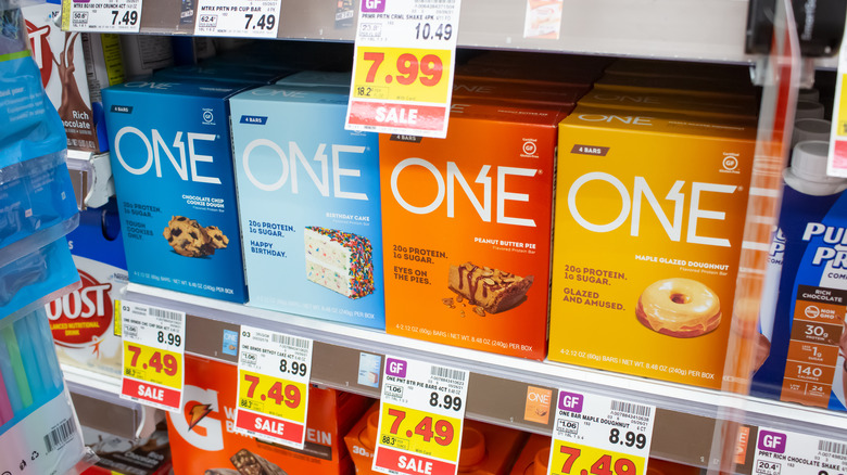 Boxes of ONE protein bars on grocery shelf