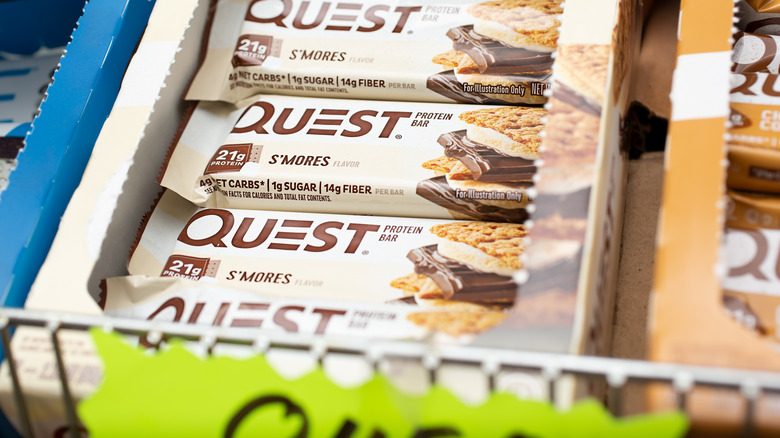 Quest bars in a box on a grocery shelf