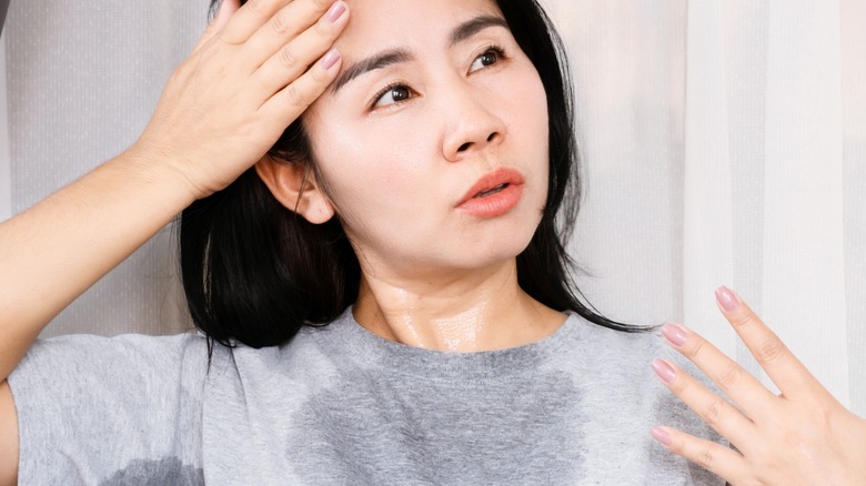 woman sweating in workout gear