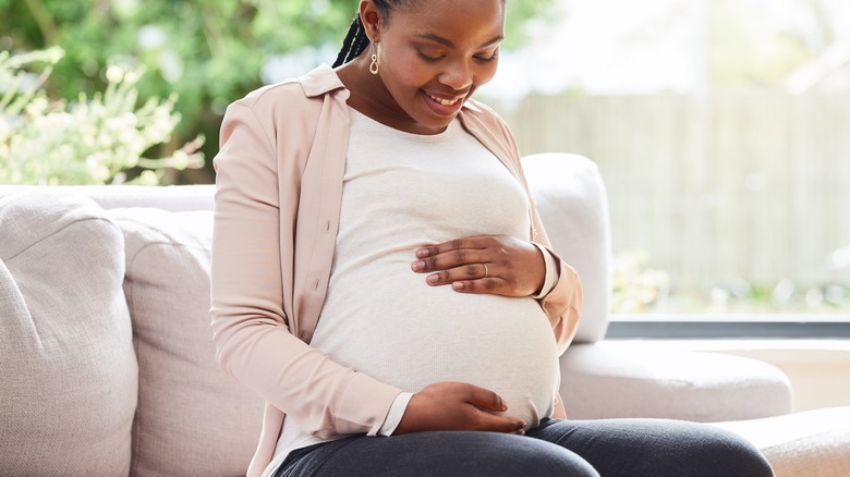 Pregnant woman sitting in chair