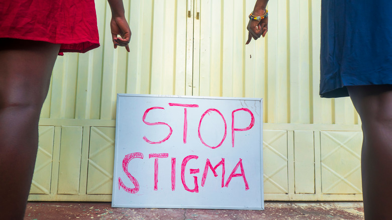 stop stigma placard on yellow gate