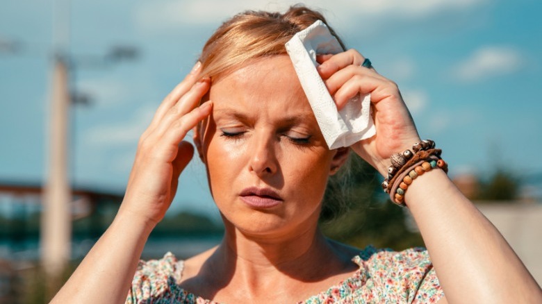 woman outdoors overheated