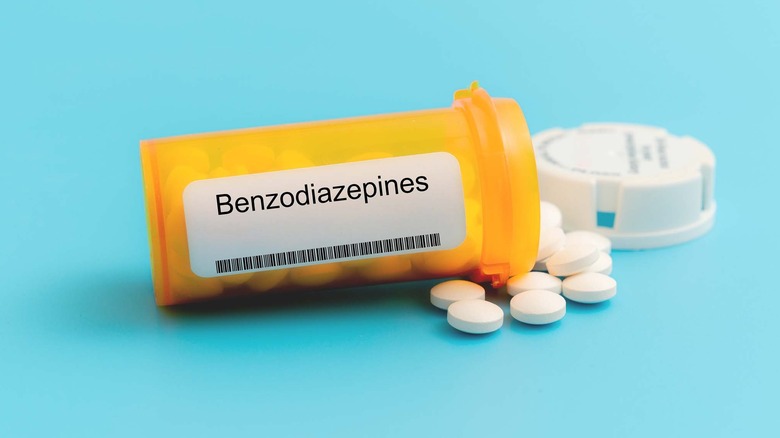 Benzodiazepene tablets spilling out of a bottle