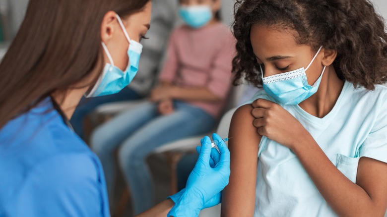 girl receiving a vaccine