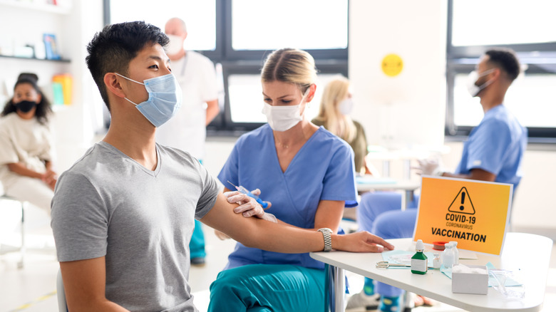 A man gets a COVID vaccine