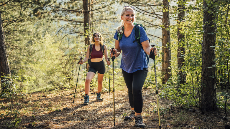 two women hiking in the woods