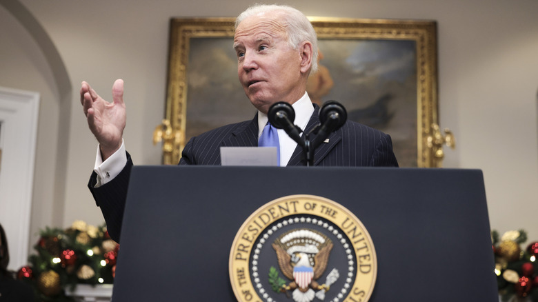 President Biden speaking behind podium