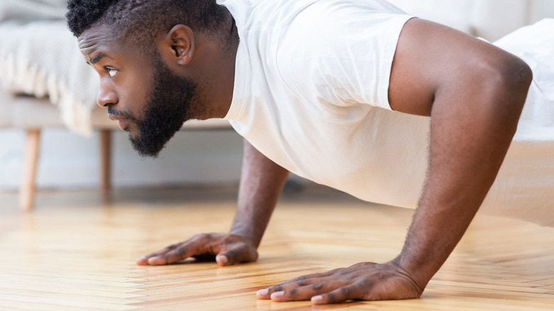 Man doing pushups on floor