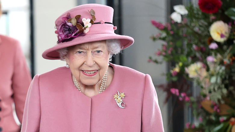 Queen Elizabeth walking with a cane